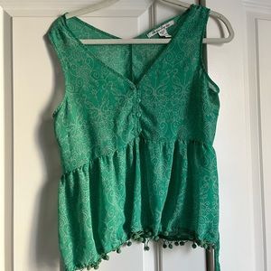 Semi sheer Green paisley like top with pom pom detail. Size small